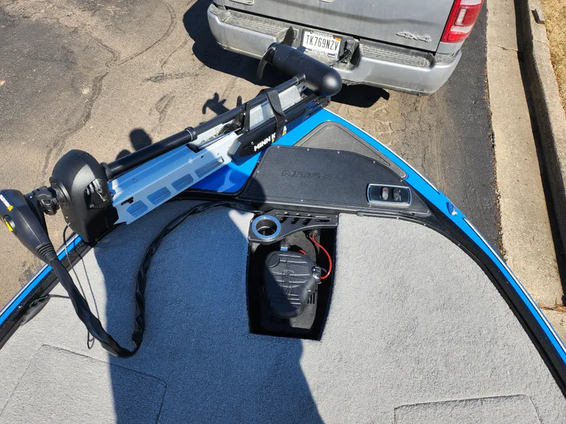 Slide: The Image of Nitro Z18 Pro 2021 boat with trolling motor, parked near a vehicle. - 17