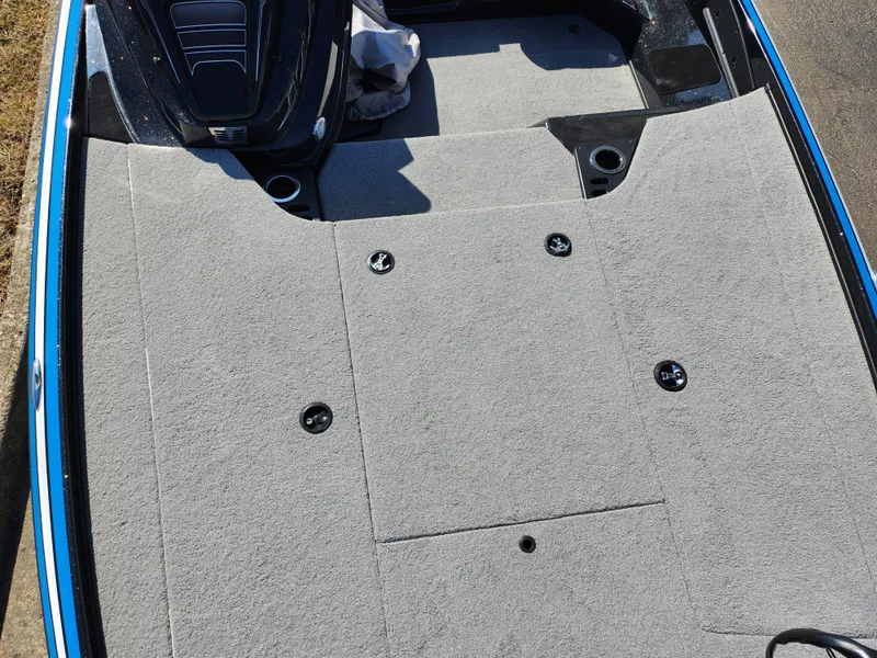 Slide: The Image of 2021 Nitro Z18 Pro boat deck with gray carpet and storage compartments. - 18