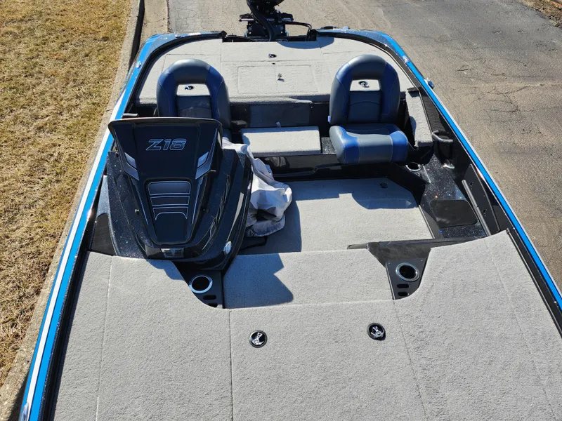 Slide: The Image of 2021 Nitro Z18 Pro boat interior with seating and carpeted deck. - 19