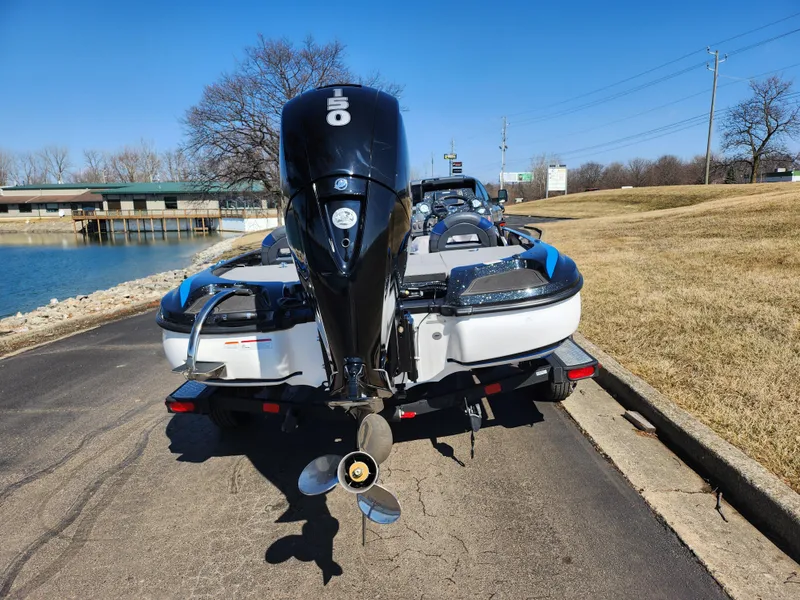 Slide: The Image of 2021 Nitro Z18 Pro boat with powerful outboard motor on a sunny day. - 2