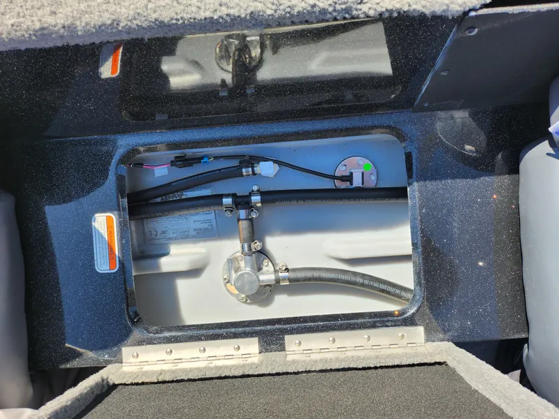 Slide: The Image of Fuel tank compartment of a 2021 Nitro Z18 Pro boat, showing hoses and connections. - 21