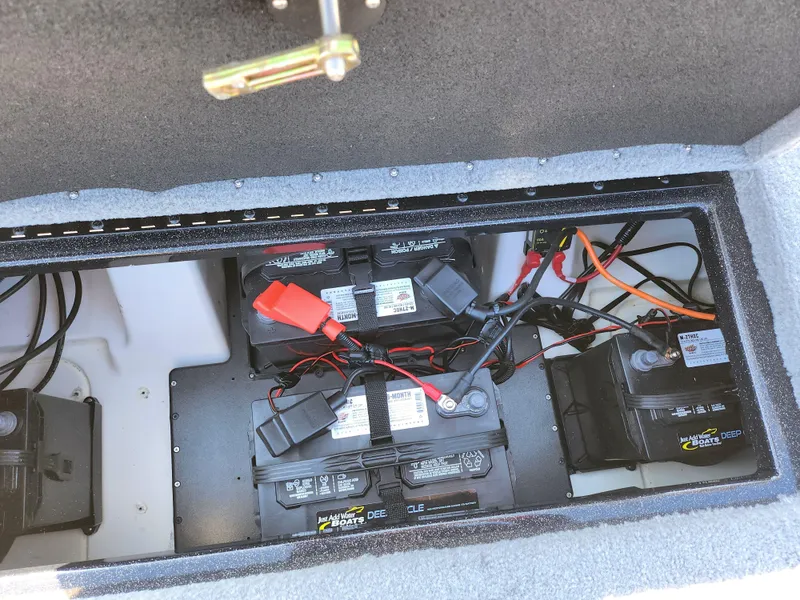 Slide: The Image of Battery compartment of a 2021 Nitro Z18 Pro boat with wiring and connections. - 23