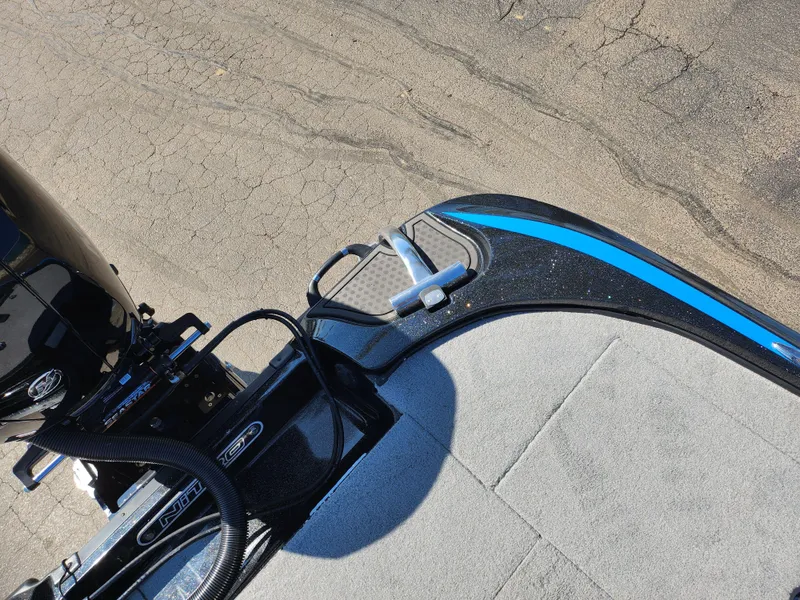 Slide: The Image of 2021 Nitro Z18 Pro boat deck with motor, featuring sleek design and blue accent. - 24