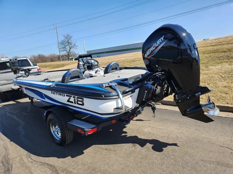 Slide: The Image of 2021 Nitro Z18 Pro boat with Mercury engine on trailer, parked outdoors. - 3