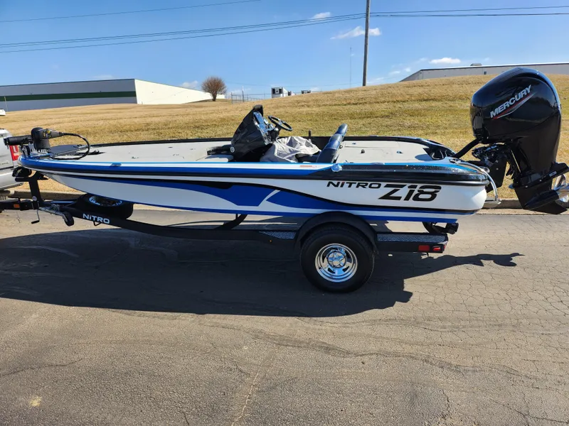 Slide: The Image of 2021 Nitro Z18 Pro boat with Mercury engine on trailer, parked outdoors. - 4