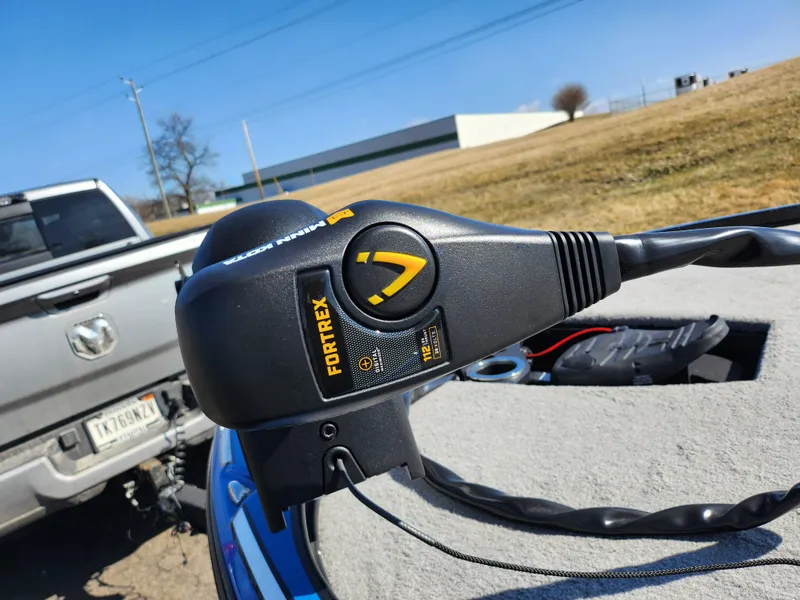Slide: The Image of Minn Kota Fortrex trolling motor on a 2021 Nitro Z18 Pro boat, parked outdoors. - 5