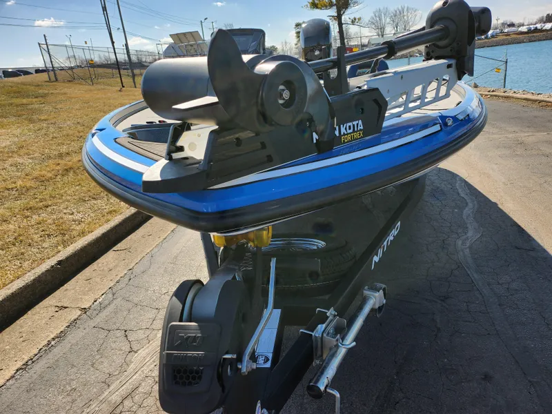 Slide: The Image of Nitro Z18 Pro 2021 boat with trolling motor, parked near a lake. - 7