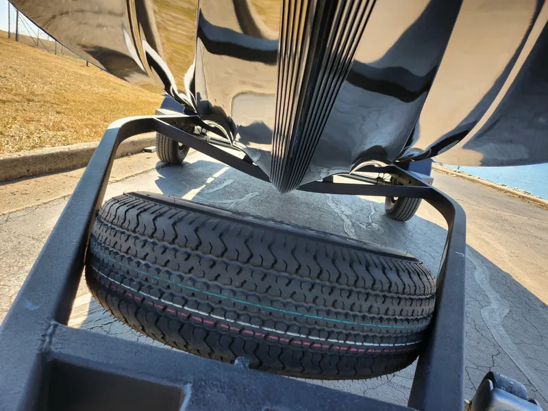Slide: The Image of Underneath view of a 2021 Nitro Z18 Pro boat on a trailer with a spare tire. - 8
