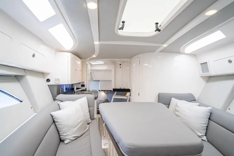 Slide: The Image of Luxurious interior of a 2020 Intrepid 407 Cuddy boat with modern seating and skylight. - 24