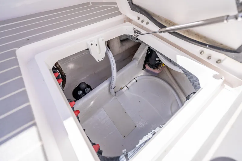 Slide: The Image of Open storage compartment in 2020 Intrepid 407 Cuddy boat, showcasing interior details. - 27
