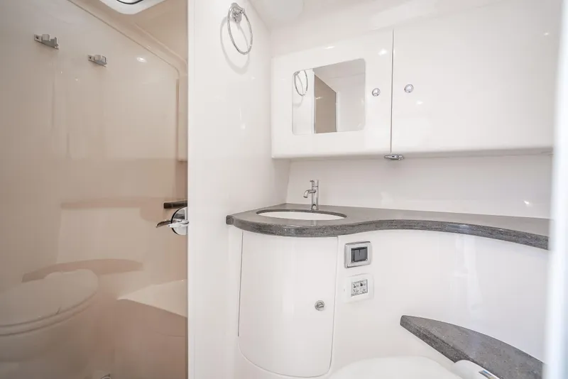 Slide: The Image of 2020 Intrepid 407 Cuddy bathroom with modern fixtures and sleek design. - 29