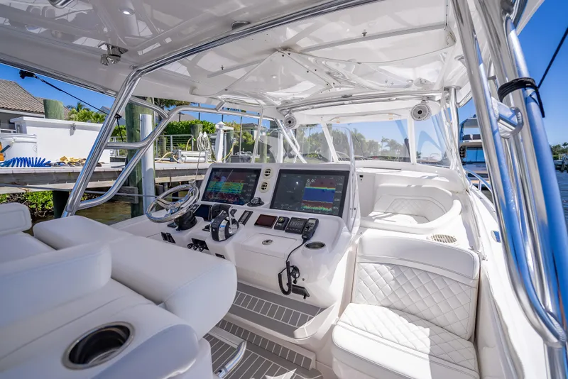 Slide: The Image of Luxurious 2020 Intrepid 407 Cuddy boat interior with advanced navigation systems and plush seating. - 34