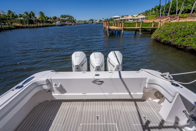 Slide: The Image of 2020 Intrepid 407 Cuddy boat with triple engines on a scenic waterway. - 41