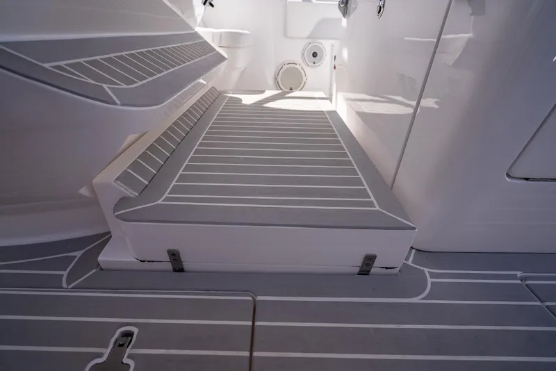 Slide: The Image of 2020 Intrepid 407 Cuddy interior with sleek, modern deck design and seating area. - 46