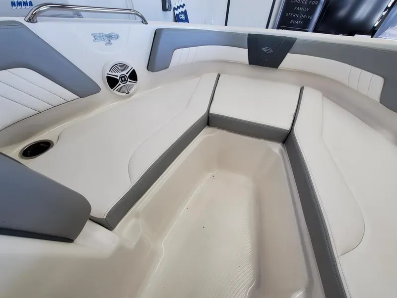 Slide: The Image of 2019 Chaparral 21 H2O OB Sport boat interior with gray and white seating. - 5