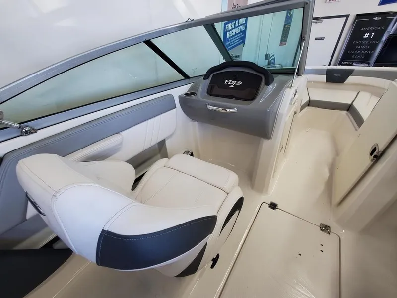 Slide: The Image of 2019 Chaparral 21 H2O OB Sport boat interior with helm and seating. - 6