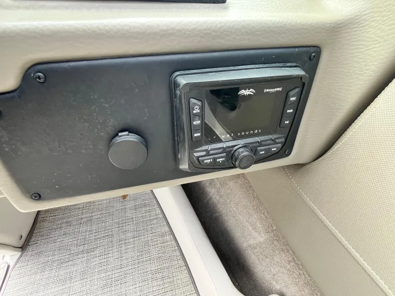 Slide: The Image of Crownline 220SS 2021 boat dashboard with audio control panel. - 15