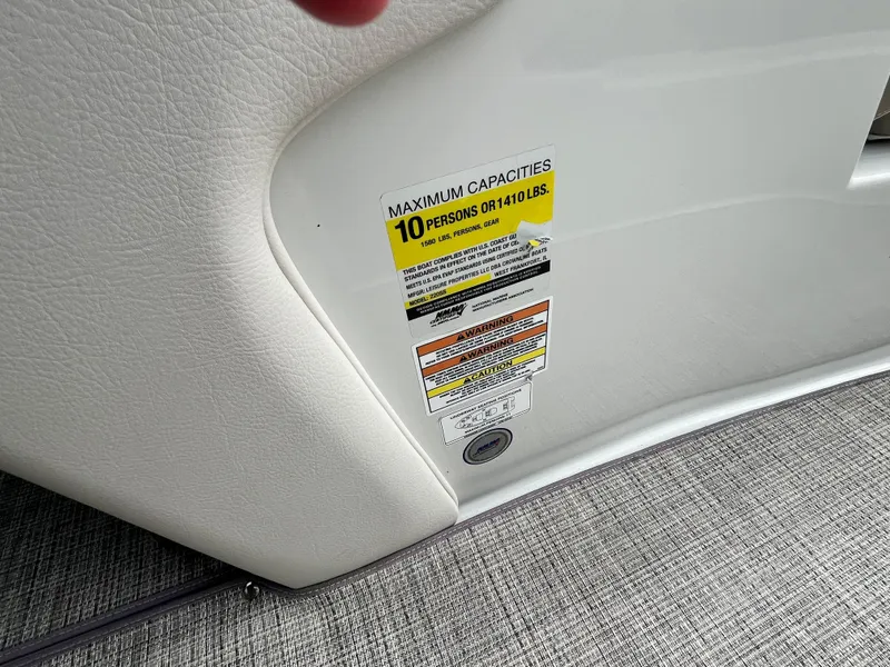 Slide: The Image of 2021 Crownline 220SS capacity label, maximum 10 persons or 1410 lbs. - 16