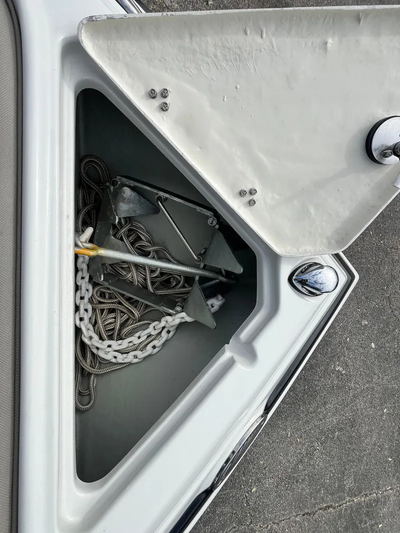 Slide: The Image of Anchor storage compartment on a 2021 Crownline 220SS boat. - 17