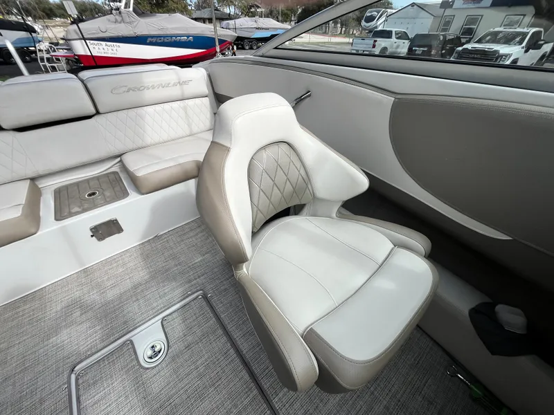 Slide: The Image of 2021 Crownline 220SS boat interior with plush seating and modern design. - 19