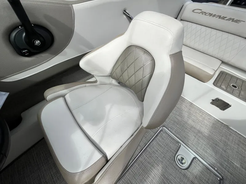 Slide: The Image of 2021 Crownline 220SS boat interior with plush seating and modern design. - 20