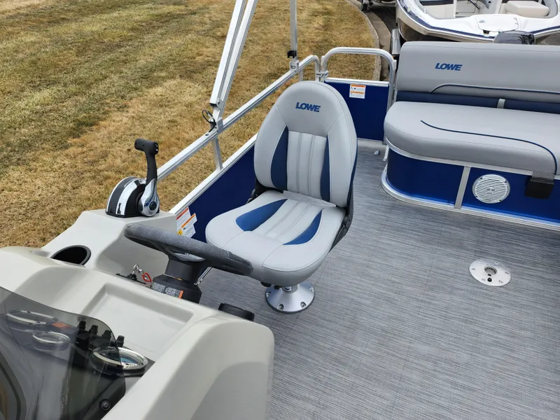 Slide: The Image of 2022 Lowe Ultra 160 Cruise boat interior with steering console and seating. - 14