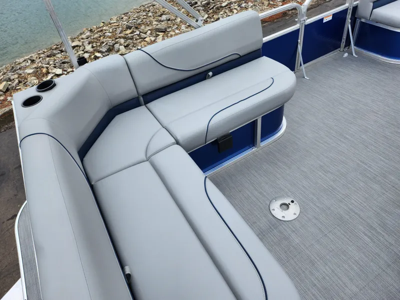 Slide: The Image of 2022 Lowe Ultra 160 Cruise boat interior with gray seating and carpeted floor. - 17