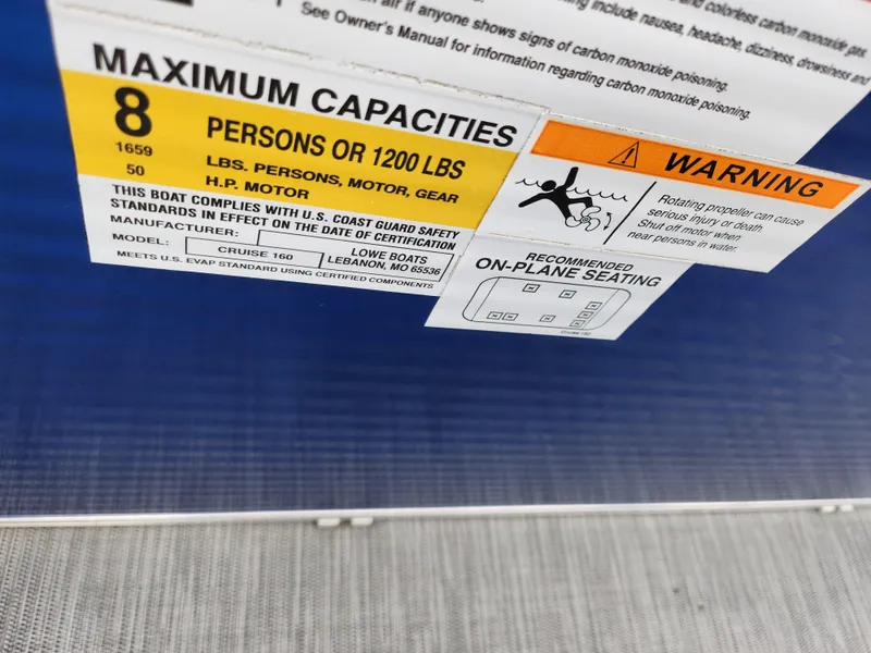 Slide: The Image of 2022 Lowe Ultra 160 Cruise capacity label, 8 persons or 1200 lbs, safety warning included. - 20