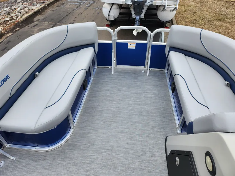 Slide: The Image of 2022 Lowe Ultra 160 Cruise pontoon boat interior with gray seating and blue accents. - 21