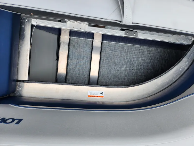 Slide: The Image of 2022 Lowe Ultra 160 Cruise boat interior detail with metal framework and upholstery. - 23