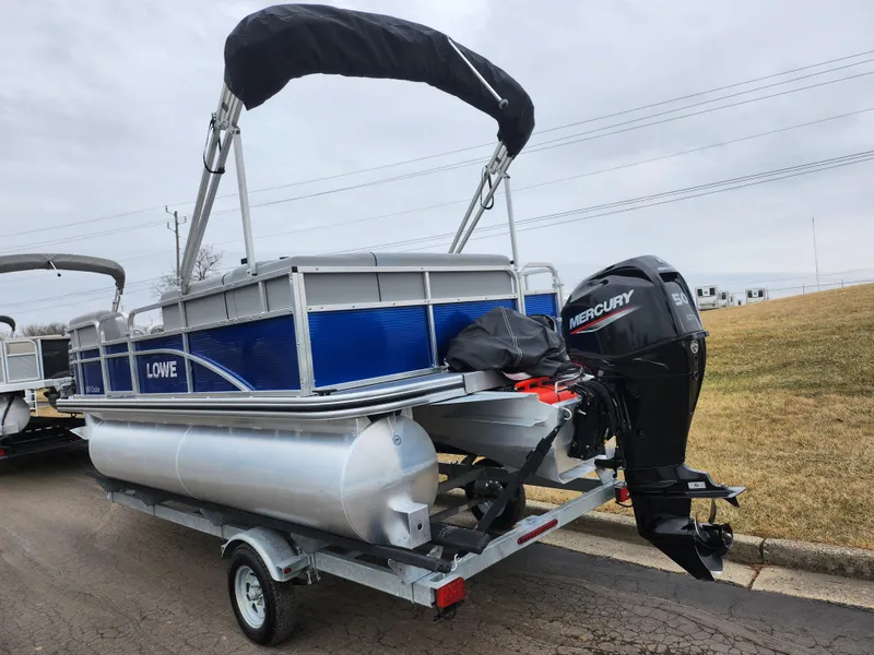 Slide: The Image of 2022 Lowe Ultra 160 Cruise pontoon boat with Mercury outboard motor on trailer. - 3