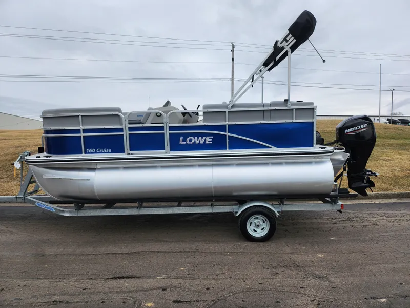 Slide: The Image of 2022 Lowe Ultra 160 Cruise pontoon boat on trailer, side view. - 4
