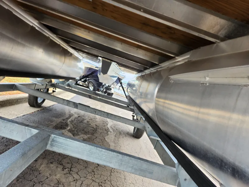 Slide: The Image of Underneath view of a 2022 Lowe Ultra 160 Cruise pontoon boat on a trailer. - 8