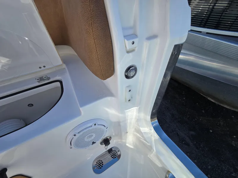 Slide: The Image of Interior view of 2022 Sea Hunt Ultra 255 SE boat, featuring speaker and control panel. - 26