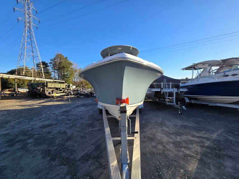 Slide: The Image of 2022 Sea Hunt Ultra 255 SE boat on trailer in outdoor storage area. - 3