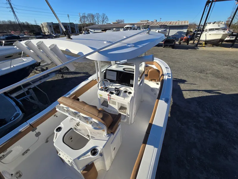 Slide: The Image of 2022 Sea Hunt Ultra 255 SE boat with spacious deck and modern console. - 31