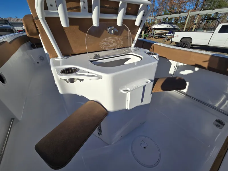 Slide: The Image of 2022 Sea Hunt Ultra 255 SE boat interior with seating and storage features. - 33