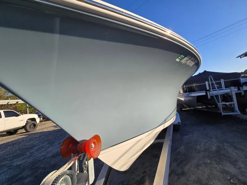Slide: The Image of 2022 Sea Hunt Ultra 255 SE boat on trailer, side view, sunny day. - 4