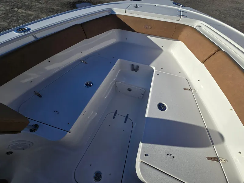 Slide: The Image of 2022 Sea Hunt Ultra 255 SE boat interior with spacious seating and storage compartments. - 40