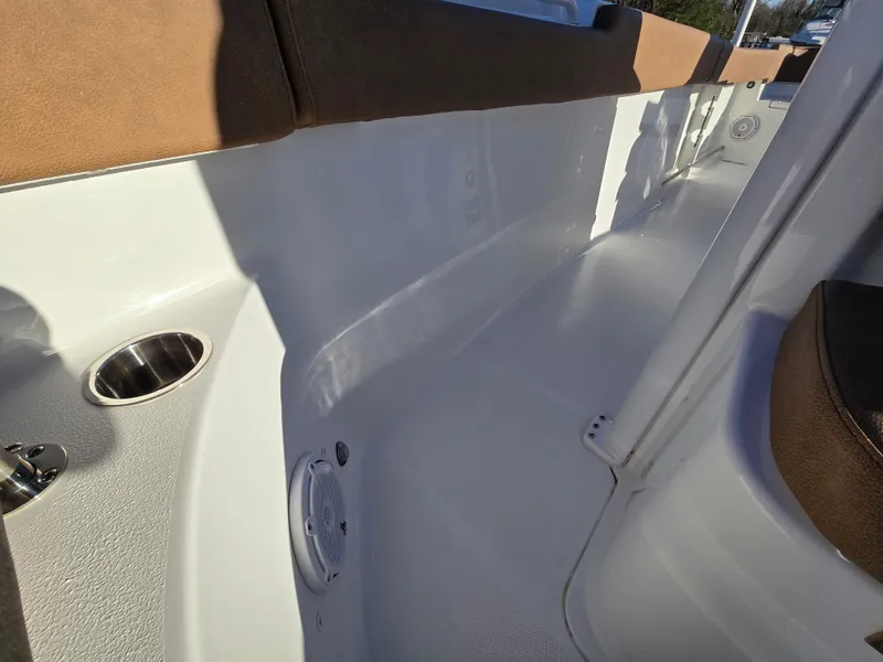 Slide: The Image of 2022 Sea Hunt Ultra 255 SE interior with seating and cup holder. - 44