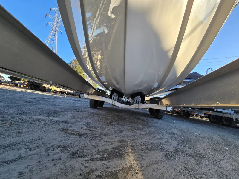 Slide: The Image of 2022 Sea Hunt Ultra 255 SE boat hull on trailer, viewed from below. - 6