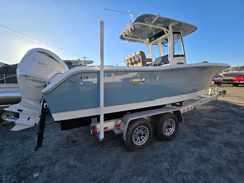 Slide: The Image of 2022 Sea Hunt Ultra 255 SE boat on trailer, side view, outdoors. - 7