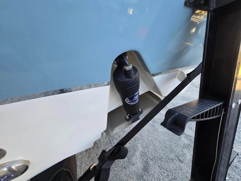 Slide: The Image of 2022 Sea Hunt Ultra 255 SE boat detail, featuring hull and trailer components. - 9