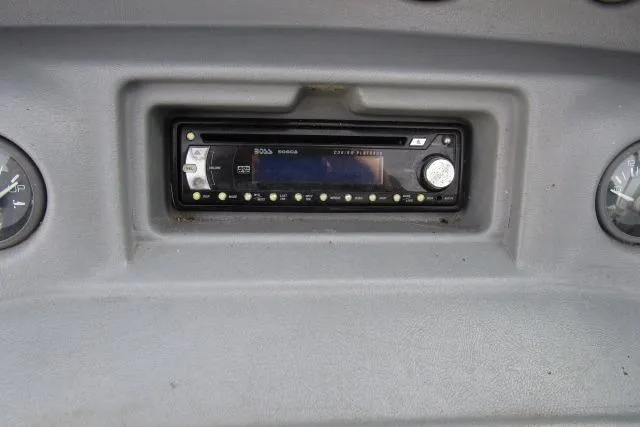 Slide: The Image of Dashboard of a 1996 Sea Ray 240 Overnighter boat with stereo system. - 11