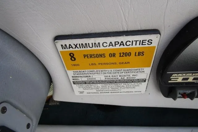 Slide: The Image of 1996 Sea Ray 240 Overnighter capacity label, maximum 8 persons or 1200 lbs. - 16
