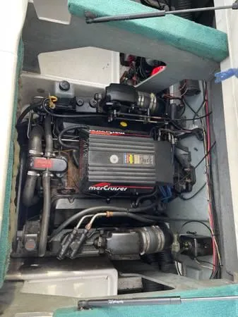 Slide: The Image of 1996 Sea Ray 240 Overnighter engine compartment with MerCruiser engine visible. - 3