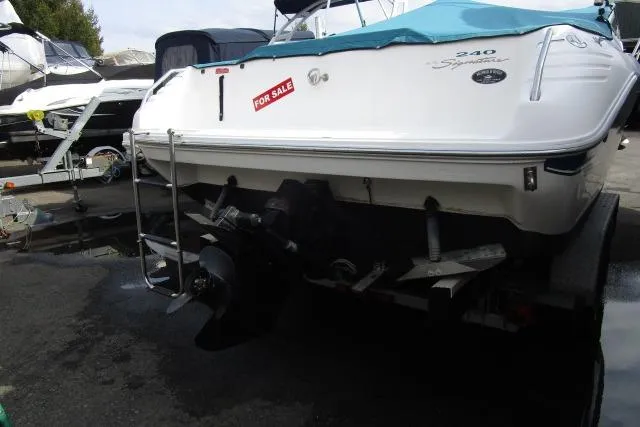Slide: The Image of 1996 Sea Ray 240 Overnighter boat for sale, rear view on trailer. - 8