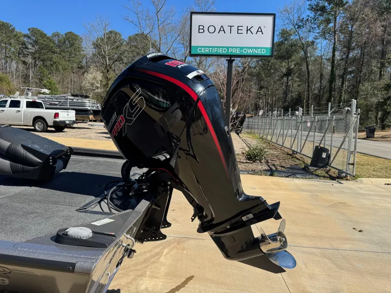 Slide: The Image of 2023 Crestliner XF 189 boat with outboard motor at Boateka dealership. - 2