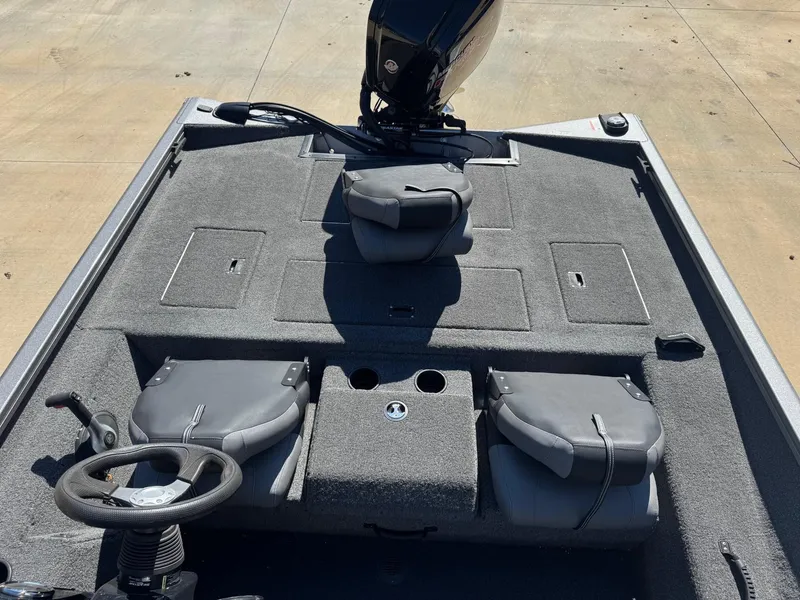 Slide: The Image of 2023 Crestliner XF 189 boat interior with seating and steering wheel, showcasing spacious design. - 4