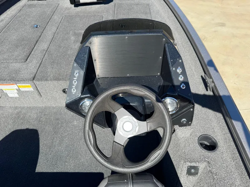 Slide: The Image of 2023 Crestliner XF 189 boat dashboard with steering wheel and control panel. - 7